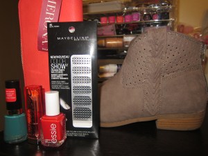 Revlon Nail Color in Trendy, Maybelline Color Whisper in Coral Ambition, Essie nail color in Snap Happy, Maynelline color show fashion prints in Metal Prisms, Merona zip around coral wallet and Mossimo paka ankle booties.