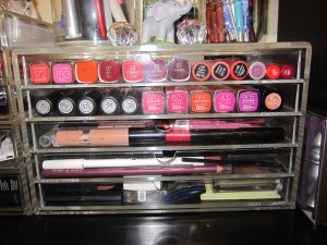 Lip tints, stains and balms in top row, Lipsticks in second, Glosses in the third, lip, eye liners and highlighters in the fourth and shadows in the fifth. 