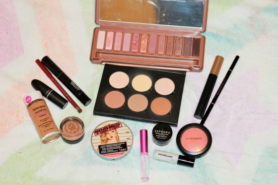 Face: Hourglass veil primer, Neutrogena nourishing long wear foundation in the shade warm beige, MAC prep and prime in Bright forecast, Anastasia contour kit in the shade Fawn, MAC blush in peaches, The Balm Mary-Lou-Manizer for highlight.  Brows: Anastasia brow wiz in the shade chocolate Eyes: MAC paint pot in "layin low" Naked 3 palette in the shades Dust (lid), Nooner (crease), Mugshot (outer corner) and Strange (brow highlight), Sephora Rio nights gel liner, Mascara Loreal Voluminous Lips: Rimmel in Cherry kiss and MAC Fashion Revival lipstick