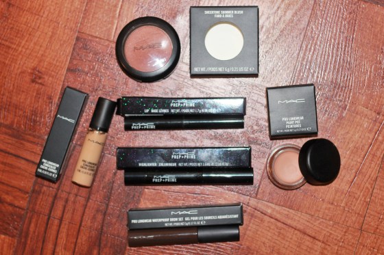 Top: Sweet as Cocoa sheertone blush Left: Pro-longwear concealer in NC30  Middle: (top to bottom) Prep and Prime lip base, Prep and Prime highlighter pen in Bright forecast and Pro-longwear waterproof brow set in Bold Brunette Right: Pro-longwear paint pot in Layin' Low